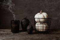 Kaboompics - Black Halloween Candle With White Pumpkins and Black Decorations