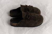 Kaboompics - Pair of Brown Suede Fringe Shoes in Minimal Product Setup