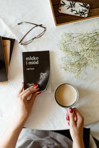 Kaboompics - Woman read book and drink coffee