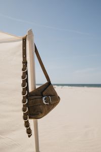 Kaboompics - Brown Leather Shoulder Bag by the Sea