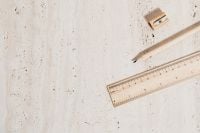 Kaboompics - Wooden Pencil, Ruler and Sharpener on Beige Stone for Minimal School and Study Layouts