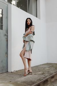 Kaboompics - Asian Fashion Model Walking in Pale Dress with Gray Jacket on Concrete Steps