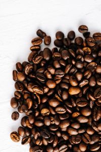 Kaboompics - Roasted Coffee Beans in the Lower Corner of a White Background for Copy Space
