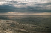 Kaboompics - Dark Clouds Over a Reflective Sea