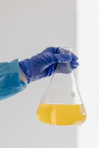 Kaboompics - Classroom Chemistry Glassware With Yellow Solution