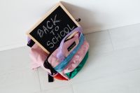 Kaboompics - Pink School Backpack with Back to School Chalkboard Sign