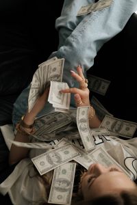 Kaboompics - Woman Lying in Dollar Bills Money Manifestation Aesthetic Wallpaper