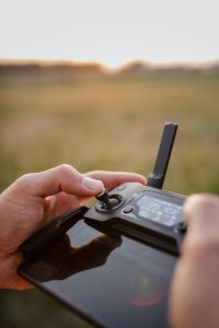 Kaboompics - Man holding remote controller for drones flying