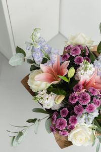 Kaboompics - Mixed Flower Bouquet with Pink Lilies and Purple Chrysanthemums on Light Background