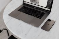 Kaboompics - MacBook Pro 15 laptop and iPhone 11 Pro on a marble table