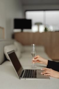 Kaboompics - Laptop and Wine Glass in a Bright Living Room