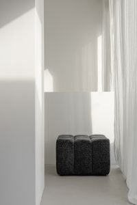 Kaboompics - Minimalist Hallway with Dark Textured Ottoman and Sheer Curtains