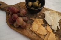 Kaboompics - Red Grapes and Cheese Board on White Linen