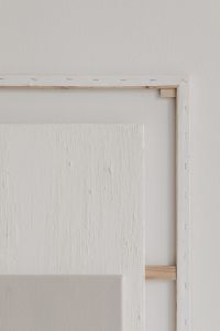 Kaboompics - Wooden Frame Behind a Textured White Panel