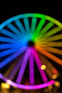 Kaboompics - Rainbow Ferris Wheel Spokes Radiating from a Dark Hub
