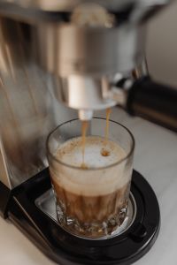 Kaboompics - Espresso Pouring into a Foamy Layered Coffee Glass