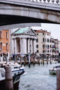 Kaboompics - Stone Bridge, Church Facade and Boats on a Venice Canal