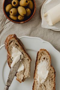 Kaboompics - Buttered Bread With Green Olives
