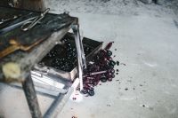 Kaboompics - Dark Glass Rods and Workshop Offcuts Scattered Across the Floor