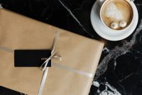 Kaboompics - Wrapping a Gift in a Coffee Shop with Dessert and Coffee