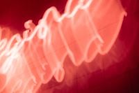 Kaboompics - Soft Red Neon Light Trails Creating Flowing Curves