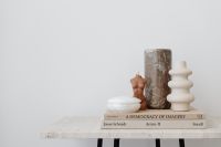 Kaboompics - White Sculptural Vase and Dried Stem on Books
