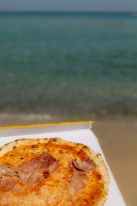 Kaboompics - Pizza Box and Blue Sea Background with Copy Space