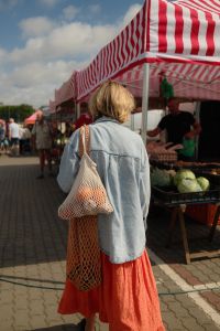 Kaboompics - Woman Carrying Reusable Produce Bags at a Farmers Market