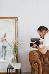 Filmmaker with DSLR Camera Taking Shoots