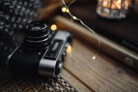 Kaboompics - Old camera, mug with tea and books