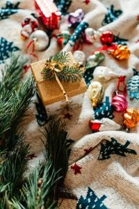 Kaboompics - Christmas gift and colourful tree decorations on a blanket