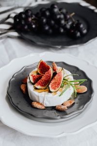 Kaboompics - Portrait Camembert and Fig Platter with Grapes on Separate Plate