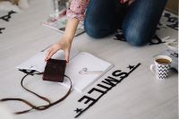 Kaboompics - Woman Arranging Scrambled Letters on a Table