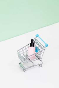 Kaboompics - Shopping Basket with Beauty Products and Large Mint Green Copy Space
