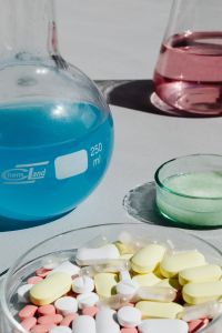 Kaboompics - Colorful Chemistry Flasks and Tablets Flat Lay