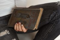 Kaboompics - Beautiful young woman reading a book