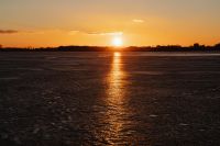 Kaboompics - Sunset Reflection on Ice Near the Reedy Shore