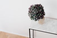 Kaboompics - Wide Hydrangea Vase Arrangement on Marble Console With Copy Space