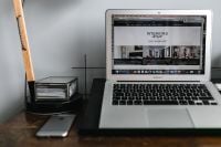 Kaboompics - Front view of laptop and mobile phone on the wooden desk