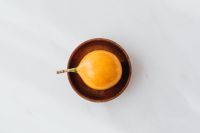 Kaboompics - Overhead Passion Fruit in a Wooden Bowl for Tropical Recipe and Menu Design