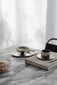Kaboompics - Coffee, Dessert and Notebook Still Life on Arabescato Marble
