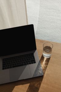 Kaboompics - Laptop Beside Sheer Curtains in a Softly Lit Workspace