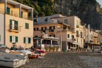 Kaboompics - Sunlit Waterfront Cafes and Seaside Buildings Below the Cliffs at Marina di Puolo
