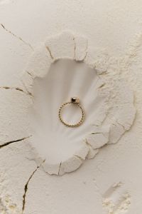 Kaboompics - Overhead Gold Ring in a Cracked Flour Background