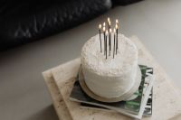 Kaboompics - White Cake with Black Candles on a Travertine Table