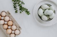 Kaboompics - Easter flat lay with green eggs on a white marble