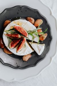 Kaboompics - Overhead Camembert Cheese Plate with Figs and Almonds