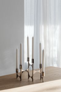 Kaboompics - Chrome Candelabra with White Candles and Dramatic Shadows