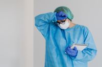 Kaboompics - Tired Lab Worker Reviewing Experiment Notes