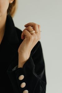 Kaboompics - Close-Up Woman's Hand Adjusting Black Blazer